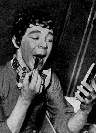 Preparing his makeup for the opening night of Dick Whittington 1955