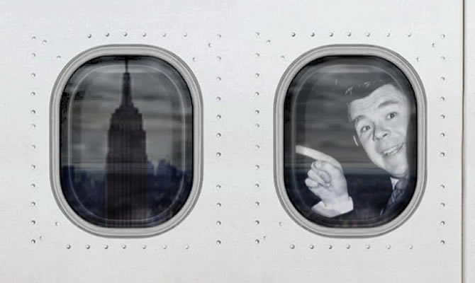 Andy Stewart looking out of the window of a jumbo jet